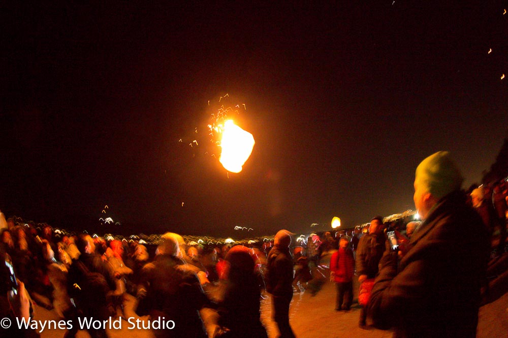 Crowd watch winter solstice lanterns